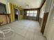 Bright sun room with tile floors and multiple windows at 3207 S De Bazan Ave, St Pete Beach, FL 33706