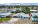 Aerial view of single-story home with neat landscaping, carport, and neighborhood setting at 323 48Th Nw St, Bradenton, FL 34209