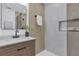 Modern bathroom featuring updated fixtures, decorative tile, and wood-style vanity at 323 48Th Nw St, Bradenton, FL 34209