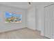 Bright bedroom with a large window, ceiling fan, and ample closet space for comfort and convenience at 323 48Th Nw St, Bradenton, FL 34209