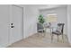 Cozy dining area featuring a glass table and two chairs, perfect for intimate meals at 323 48Th Nw St, Bradenton, FL 34209