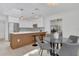 Stylish kitchen features a breakfast bar, modern appliances, and hardwood floors at 323 48Th Nw St, Bradenton, FL 34209
