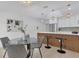 Cozy breakfast nook and island seating in a bright kitchen with stylish pendant lighting at 323 48Th Nw St, Bradenton, FL 34209