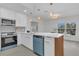 A renovated kitchen featuring an island, stainless steel appliances, and eat-in dining space at 323 48Th Nw St, Bradenton, FL 34209