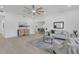 Bright and airy living room featuring hardwood floors, modern furnishings, and neutral tones at 323 48Th Nw St, Bradenton, FL 34209
