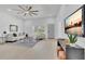 Inviting living room with natural light, modern furnishings, and a stylish entertainment area at 323 48Th Nw St, Bradenton, FL 34209