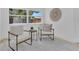Inviting sitting area with comfortable chairs, perfect for relaxing and enjoying the natural light at 323 48Th Nw St, Bradenton, FL 34209