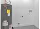 Clean utility room featuring a new Rheem Performance water heater at 323 48Th Nw St, Bradenton, FL 34209
