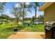 Backyard with lake view, fire pit and seating area at 3366 Clover Leaf Ln, Land O Lakes, FL 34639