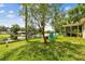 The backyard has a lake view and adirondack chairs at 3366 Clover Leaf Ln, Land O Lakes, FL 34639