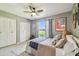 Well-lit bedroom with a large window, ceiling fan and closet at 3366 Clover Leaf Ln, Land O Lakes, FL 34639