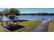 Lakeside community picnic area with covered shelter and boat ramp, offering outdoor recreation and relaxation at 3366 Clover Leaf Ln, Land O Lakes, FL 34639