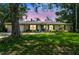 Charming one-story home with a well-manicured lawn and mature landscaping at 3366 Clover Leaf Ln, Land O Lakes, FL 34639