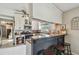 Well-lit kitchen showcases granite countertops, stainless steel appliances, and a breakfast bar with seating at 3366 Clover Leaf Ln, Land O Lakes, FL 34639