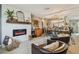 Cozy living room featuring a modern fireplace, shiplap accent wall, and stylish decor at 3366 Clover Leaf Ln, Land O Lakes, FL 34639