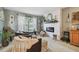 Inviting living room with a decorative fireplace, comfortable seating, and ample natural light at 3366 Clover Leaf Ln, Land O Lakes, FL 34639