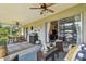 Spacious screened patio with ceiling fans and comfortable seating at 3366 Clover Leaf Ln, Land O Lakes, FL 34639