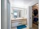 Bright bathroom with double sinks, vanity, and a large mirror with plenty of light at 34507 Cedarfield Dr, Dade City, FL 33523
