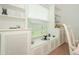 Dining nook with built-in window seat and storage, offering bright natural light and a cozy atmosphere at 34507 Cedarfield Dr, Dade City, FL 33523