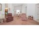 Bright dining room with white furniture, built-in shelves, and vaulted ceilings offers a spacious and inviting atmosphere at 34507 Cedarfield Dr, Dade City, FL 33523