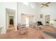 Spacious living room boasting vaulted ceilings, natural light, carpeted floor, and an open layout at 34507 Cedarfield Dr, Dade City, FL 33523