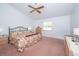 Spacious main bedroom featuring a ceiling fan, natural light, and a serene atmosphere at 34507 Cedarfield Dr, Dade City, FL 33523