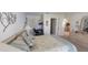 Inviting bedroom with neutral decor, comfortable bed, and a view into another room at 3505 Tarpon Woods Blvd # I407, Palm Harbor, FL 34685