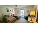 Charming bedroom featuring twin beds, a ceiling fan, and natural light for a comfortable stay at 3505 Tarpon Woods Blvd # I407, Palm Harbor, FL 34685