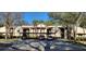Exterior view of condos with covered parking and mature landscaping and trees at 3505 Tarpon Woods Blvd # I407, Palm Harbor, FL 34685