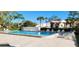 Beautiful community pool with ample lounge chairs and a clear blue swimming area at 3505 Tarpon Woods Blvd # I407, Palm Harbor, FL 34685