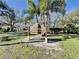 Carpon Woods Condo IV community sign surrounded by landscaping and palm trees at 3505 Tarpon Woods Blvd # I407, Palm Harbor, FL 34685