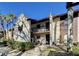 Two-story condo with a well-maintained landscape and walkway leading to the entrance at 3505 Tarpon Woods Blvd # I407, Palm Harbor, FL 34685