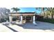Inviting pool area surrounded by lounge chairs, tables, and a covered space perfect for relaxation and socializing at 3505 Tarpon Woods Blvd # I407, Palm Harbor, FL 34685