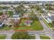 Overhead view showcasing a property with a well-maintained lawn, and tree coverage in a quiet neighborhood at 4001 W Carmen St # 1/2, Tampa, FL 33609