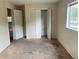 A bedroom featuring a closet with shutter doors at 403 E Carolina Ave, Plant City, FL 33563