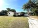Charming single-story home featuring a detached garage and a long driveway at 403 E Carolina Ave, Plant City, FL 33563