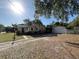 Charming single-story home featuring a detached garage and a long driveway at 403 E Carolina Ave, Plant City, FL 33563