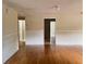 Spacious living room with wood floors ready for customization at 403 E Carolina Ave, Plant City, FL 33563