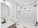 Elegant bathroom featuring marble tile, modern fixtures, and a sleek vanity at 4215 E Paris St, Tampa, FL 33610