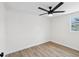 Bright bedroom features a ceiling fan, a window, and wood floors at 4215 E Paris St, Tampa, FL 33610
