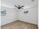 Bright bedroom with new laminate floors and natural light from multiple windows at 4215 E Paris St, Tampa, FL 33610