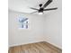 Cozy bedroom with new laminate floors, natural light, and a ceiling fan at 4215 E Paris St, Tampa, FL 33610