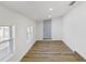 Bright entryway featuring wood-look flooring, white walls, and a light blue door at 4215 E Paris St, Tampa, FL 33610