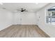 Bright and airy living room with new laminate floors and natural light at 4215 E Paris St, Tampa, FL 33610