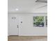 Bright and airy living room with new laminate floors and natural light at 4215 E Paris St, Tampa, FL 33610