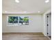 Bright living room with wood floors and a large window at 4215 E Paris St, Tampa, FL 33610