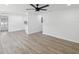 Spacious living room with new laminate floors, recessed lighting, and fresh paint at 4215 E Paris St, Tampa, FL 33610