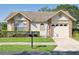 Charming single-story home featuring well-maintained landscaping, a one-car garage, and a welcoming facade at 4655 Wallingford Ct # 4655, New Port Richey, FL 34655