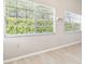 Bright living room with large windows and neutral paint and flooring at 4655 Wallingford Ct # 4655, New Port Richey, FL 34655