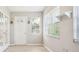 Bright living room features a large front door and big, bright windows at 4655 Wallingford Ct # 4655, New Port Richey, FL 34655